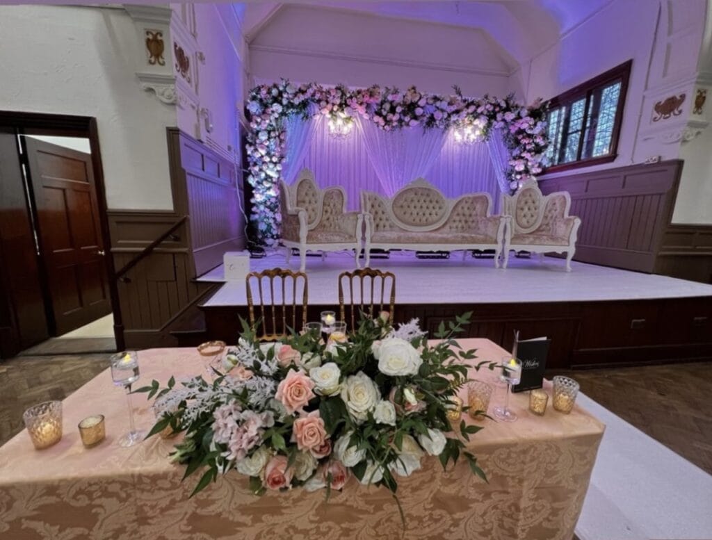 Waddesdon Hall dressed for a wedding - with elaborate chairs on the stage