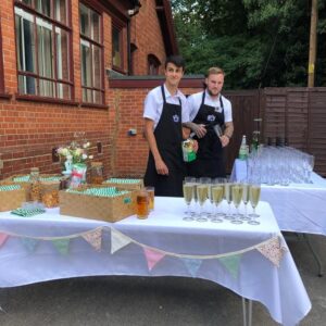 Serving drinks outside Waddesdon Hall for a party